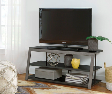TV stands and storage organizers for a small living room space.